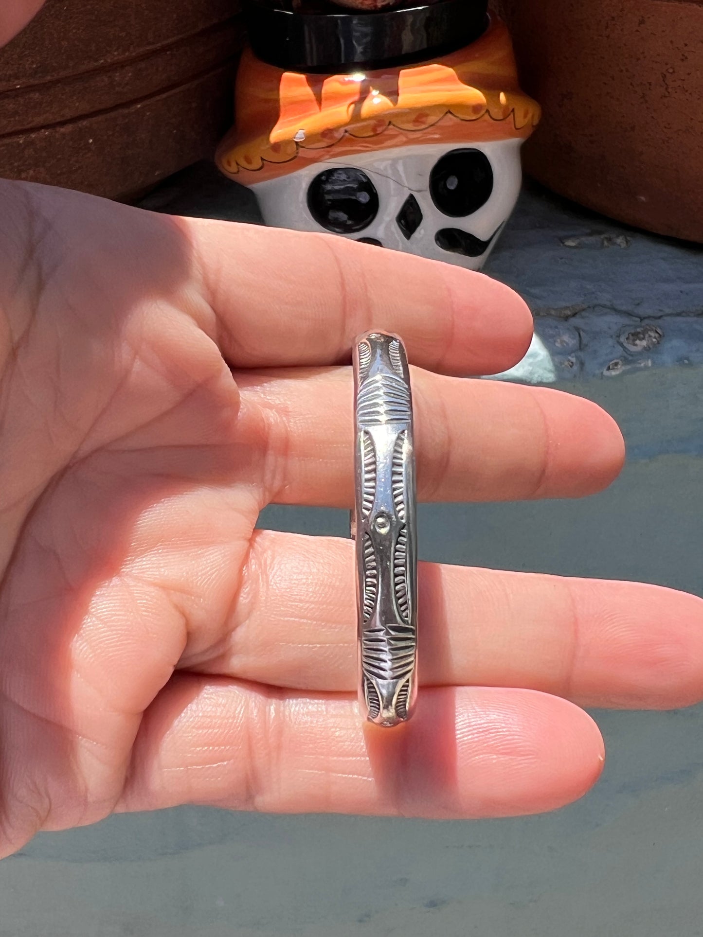 Stamped stacker cuff