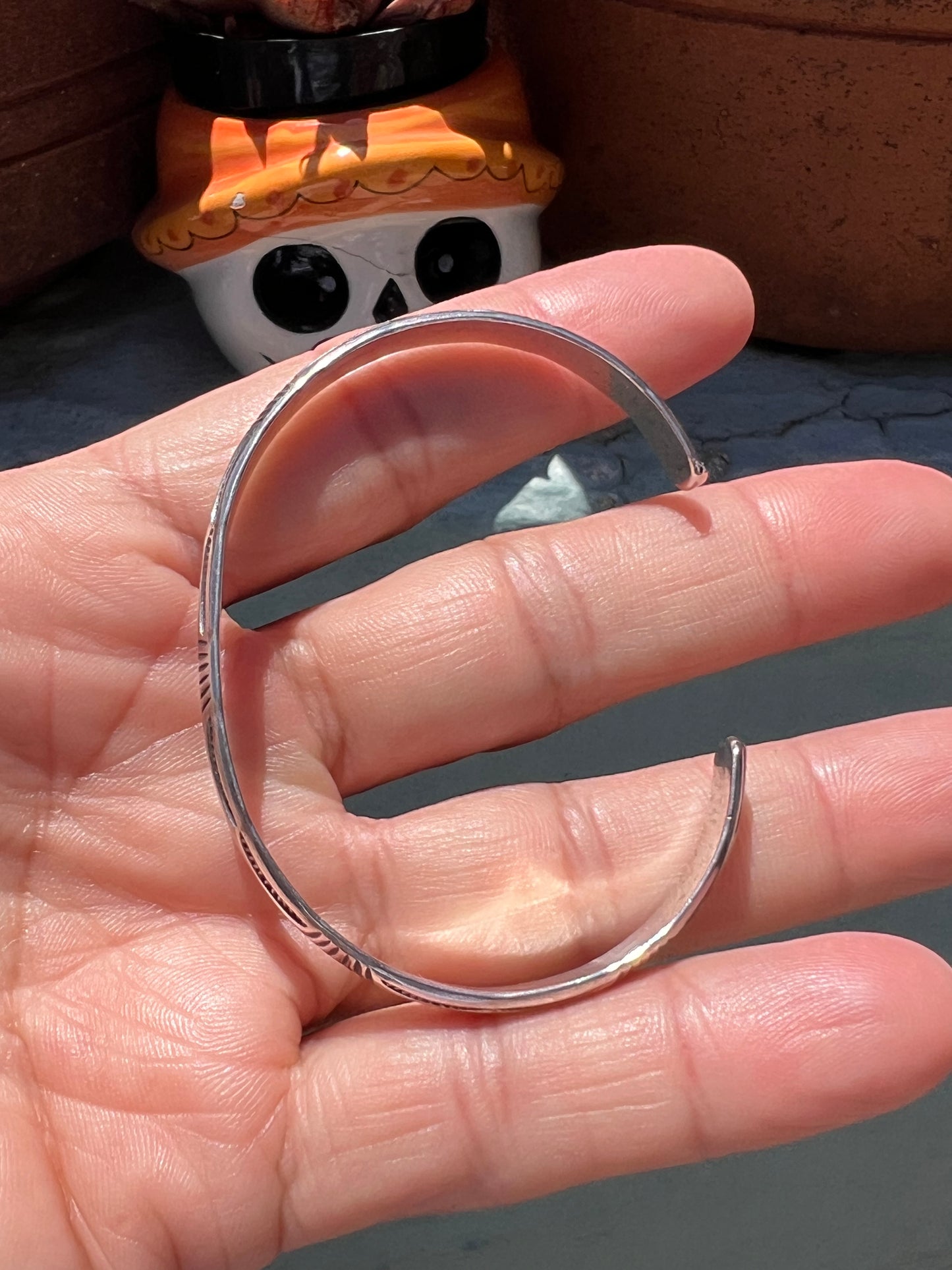 Stamped stacker cuff
