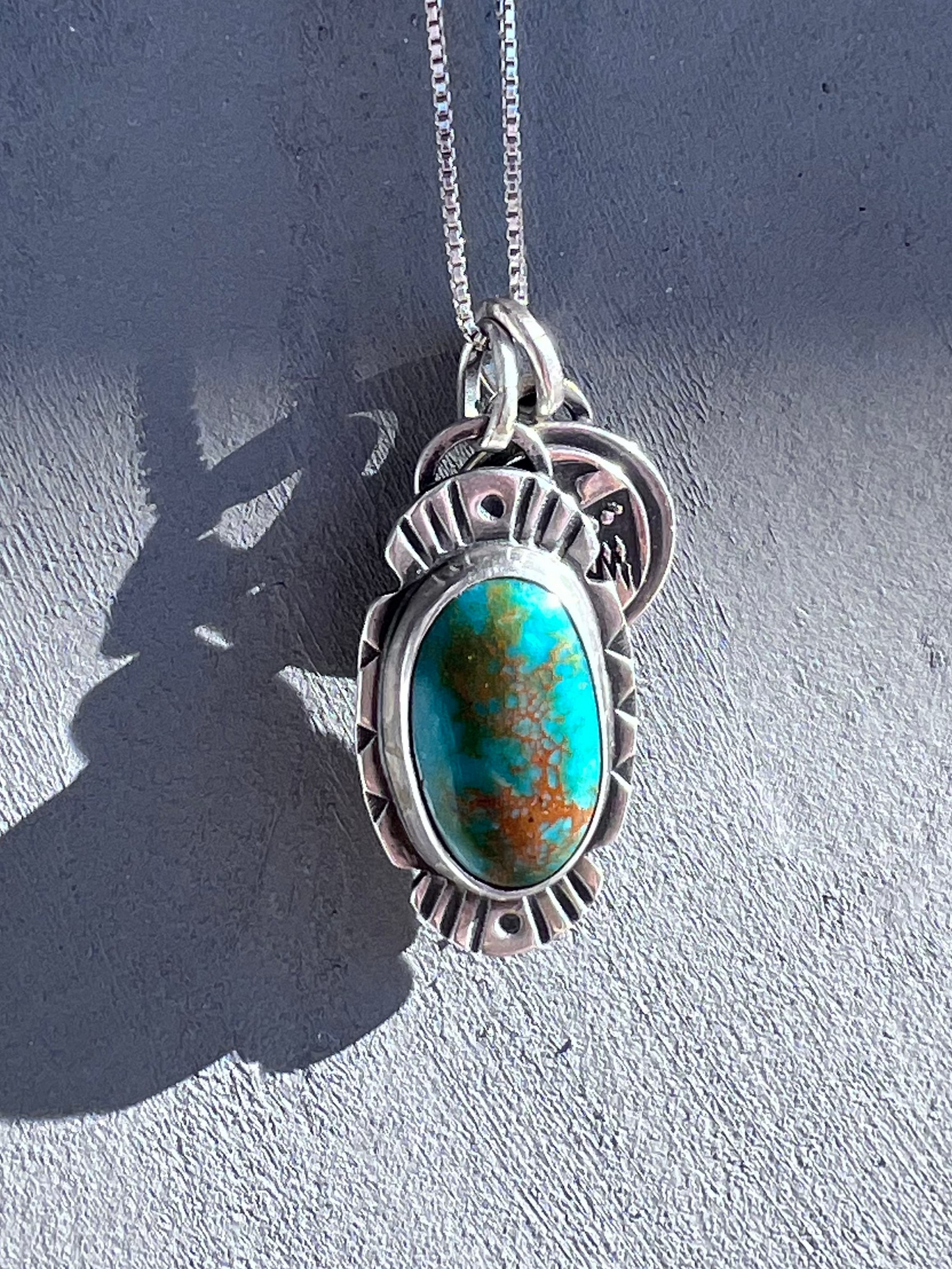 Green Turquoise and thunderbird Pendant